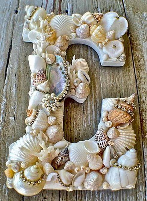 wooden letters with a seashell