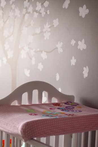 white crib on nursery room