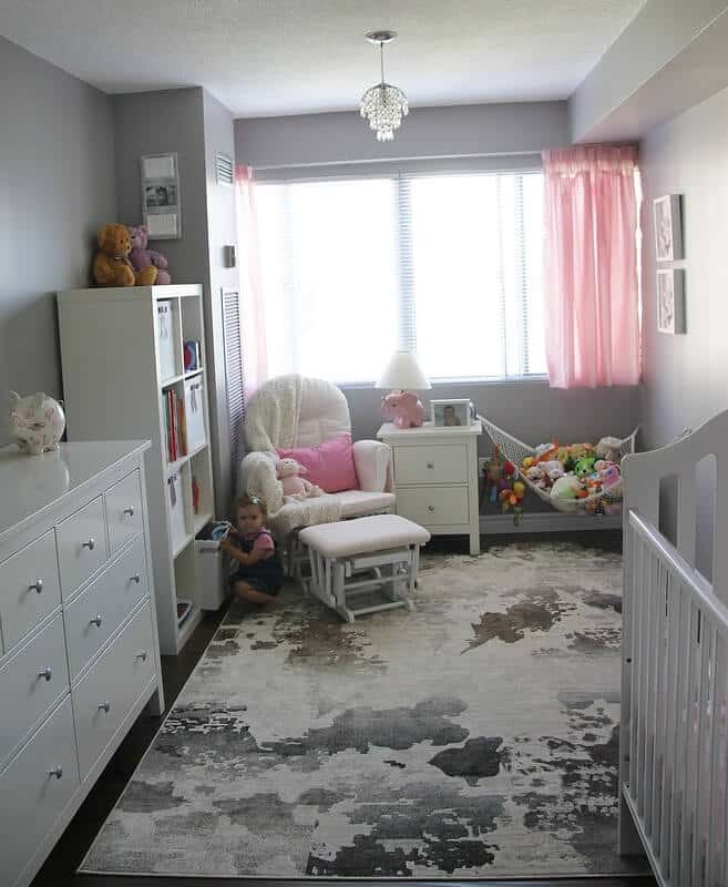 toy storage hammock on Maya's pink and gray room