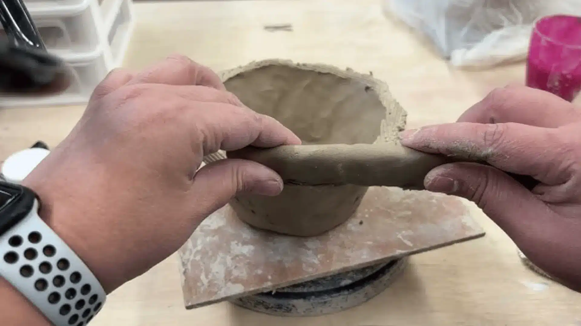 a person using the bonding pinch for coils 