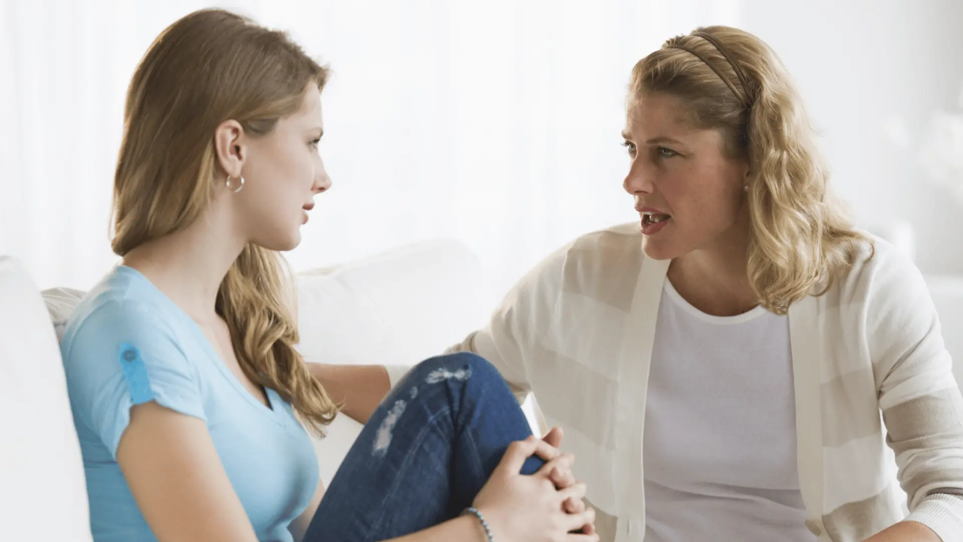 a mother talking to her teenage daughter 