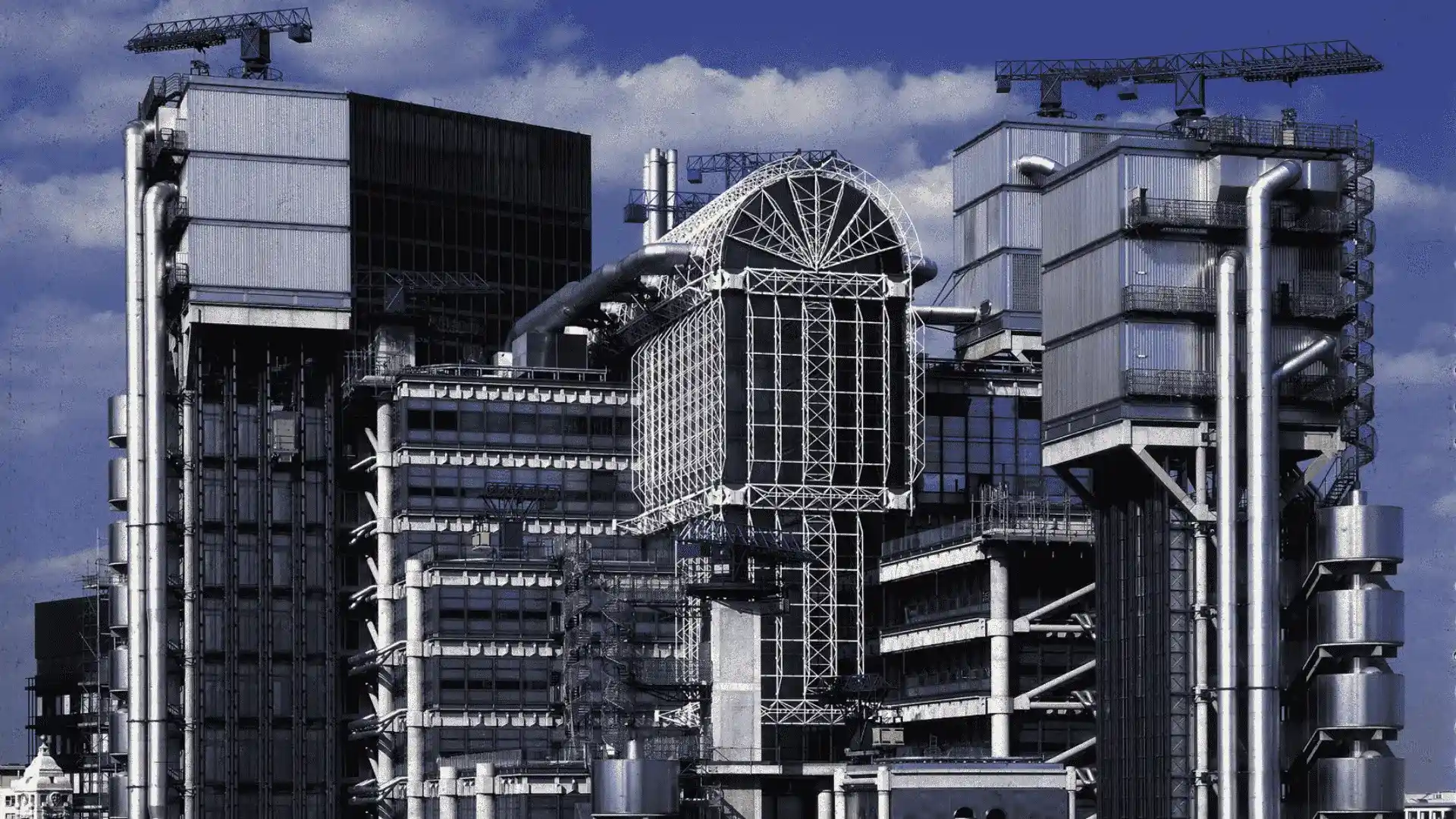 The Lloyd’s Building, a prominent example of postmodern architecture in London, displays a variety of building types.