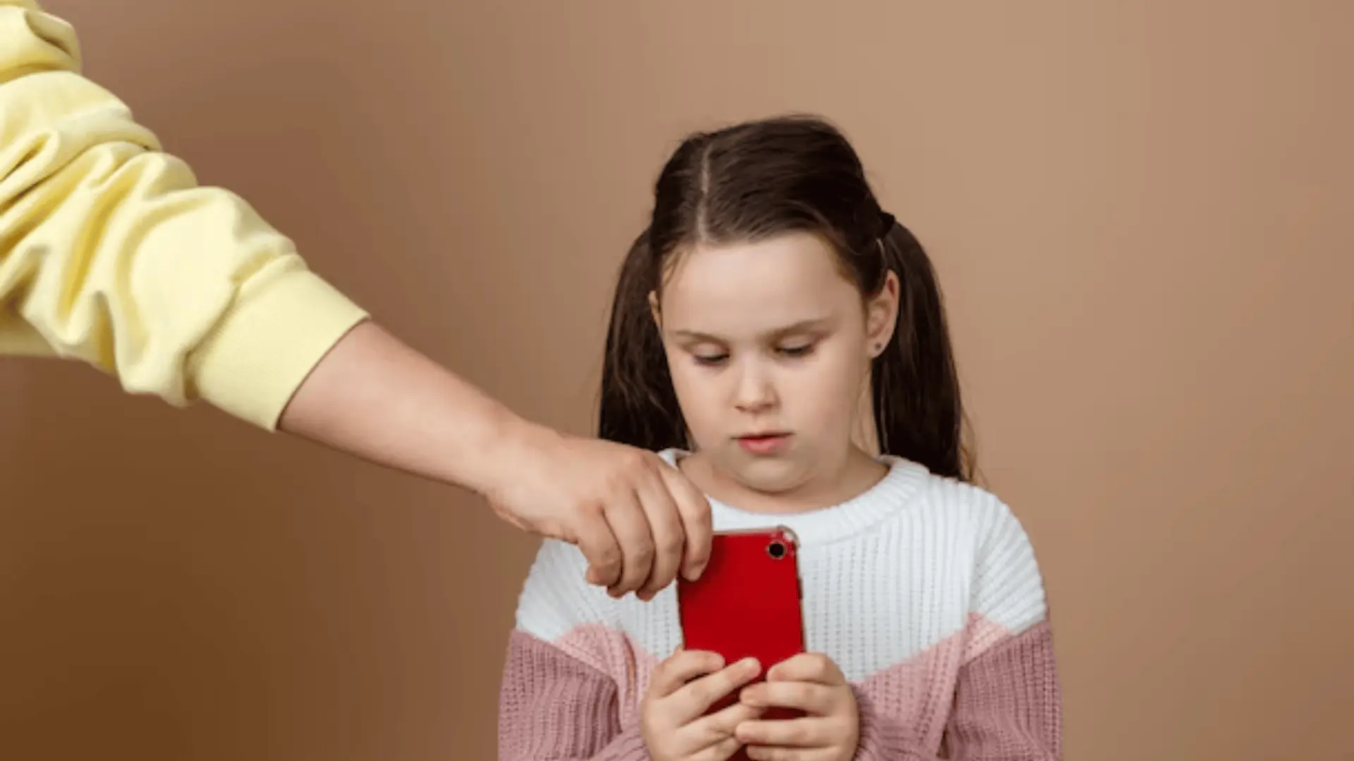 a parent taking away phone from their kid