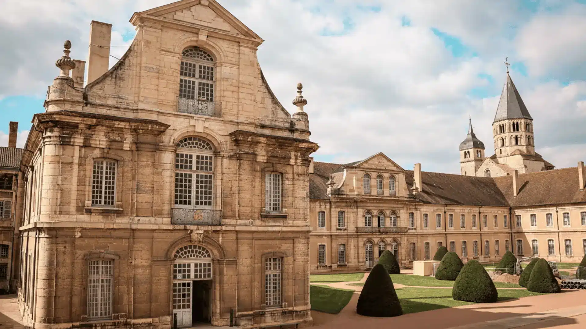 Cluny Abbey, a renowned Romanesque structure, tilts elegantly against the backdrop of France