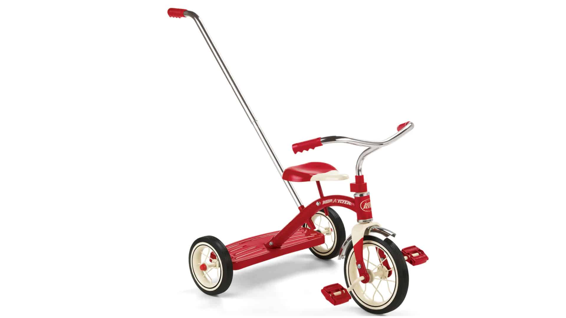 Radio Flyer wooden push walker with activity board and rear storage bin, shown in a clean product photo on white.