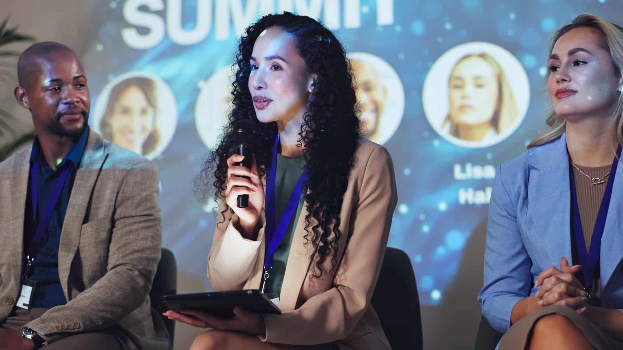 Panel of community experts speaking to an audience during a mental health discussion event<