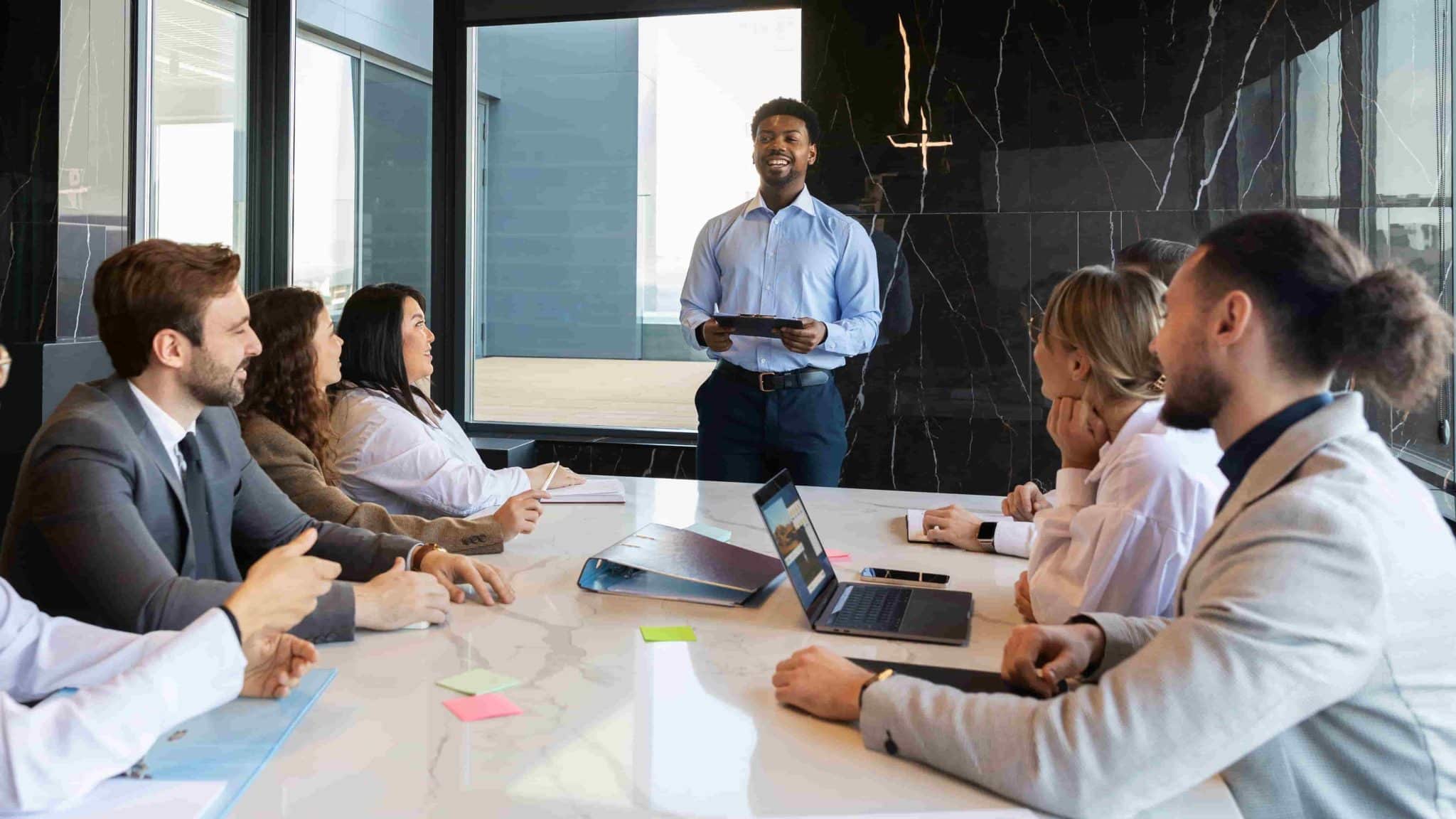 Employees attending a workplace lunch and learn session with a mental health speaker